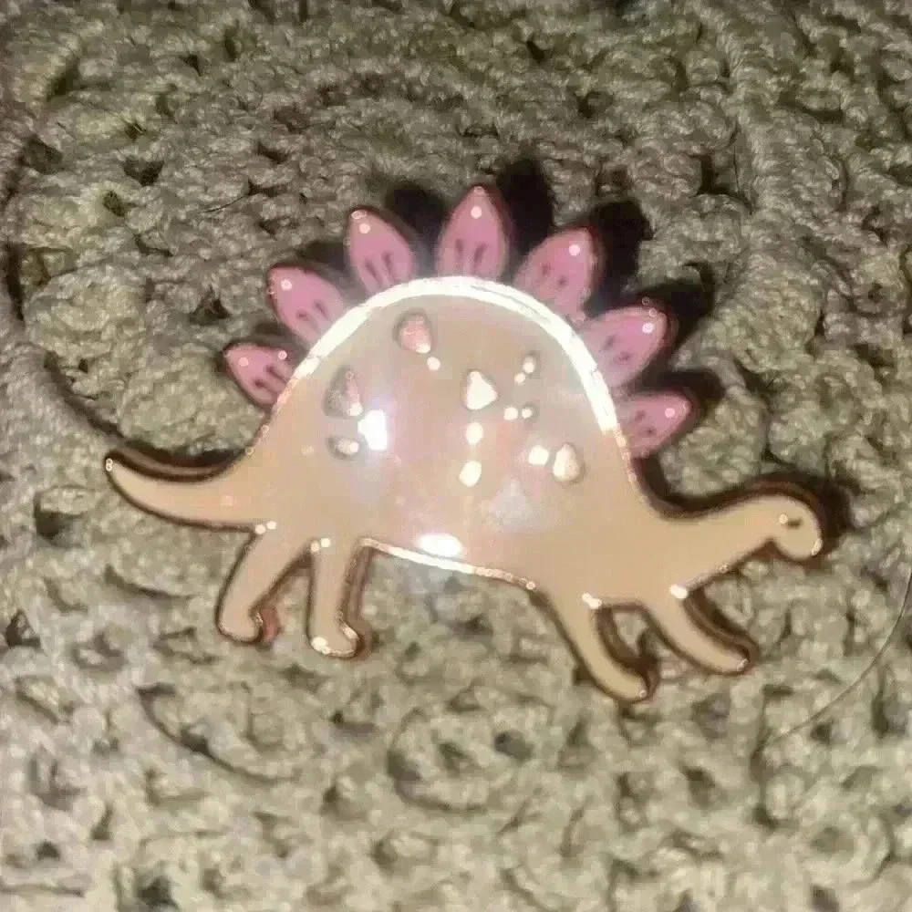 Novelty pin lot, including 1 Pokémon pin